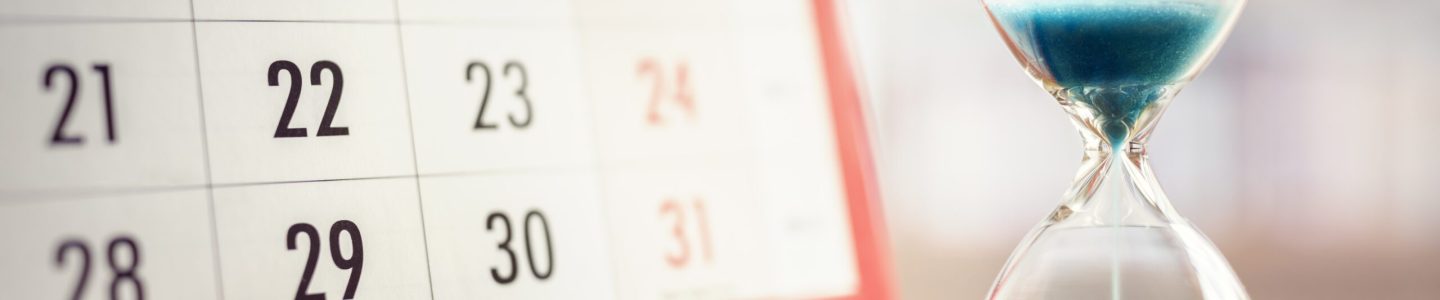 Hour glass and calendar concept for time slipping away for important appointment date, schedule and deadline